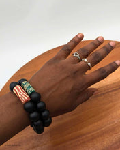 Load image into Gallery viewer, Onyx bracelet with RED African bead